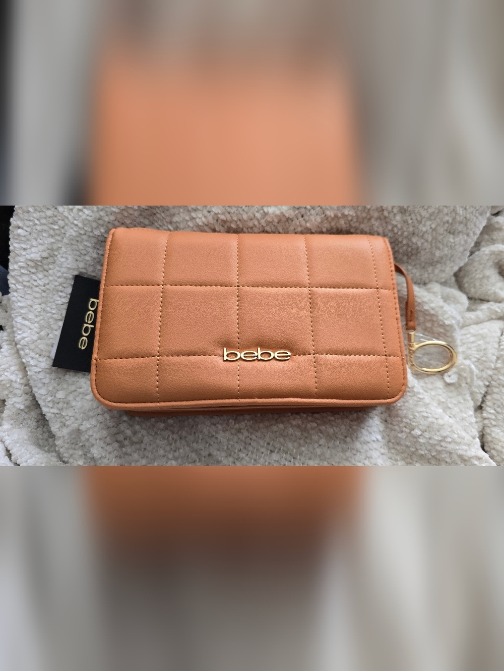 bebe Quilted Wristlet in Peachy Tan with Gold Logo
